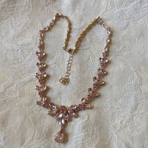 Elegant gold tone metal pink crystal floral design necklace